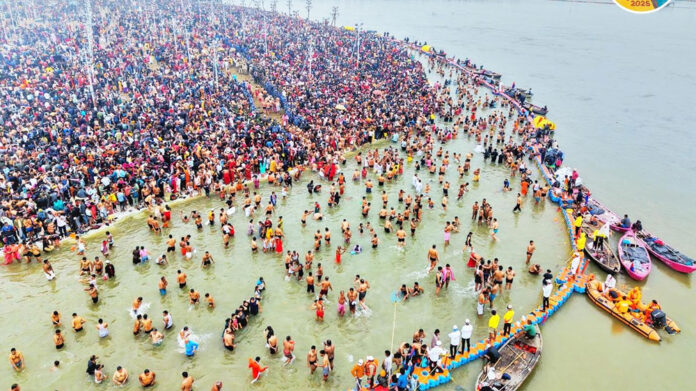 Devotees take holy dip at Mahakumbh despite bitter cold