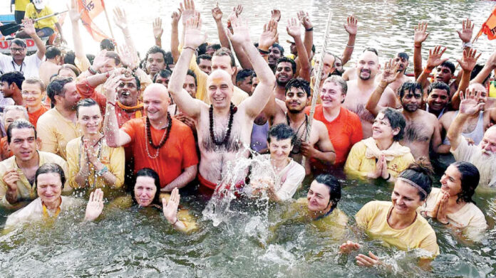 Foreigners flock to take holy dip at Kumbh Mela..!