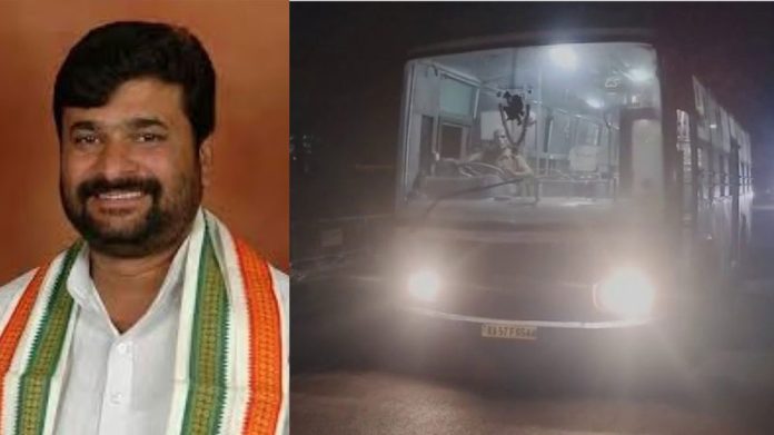 Portrait of a man in a white shirt wearing a green‑orange scarf (left side).